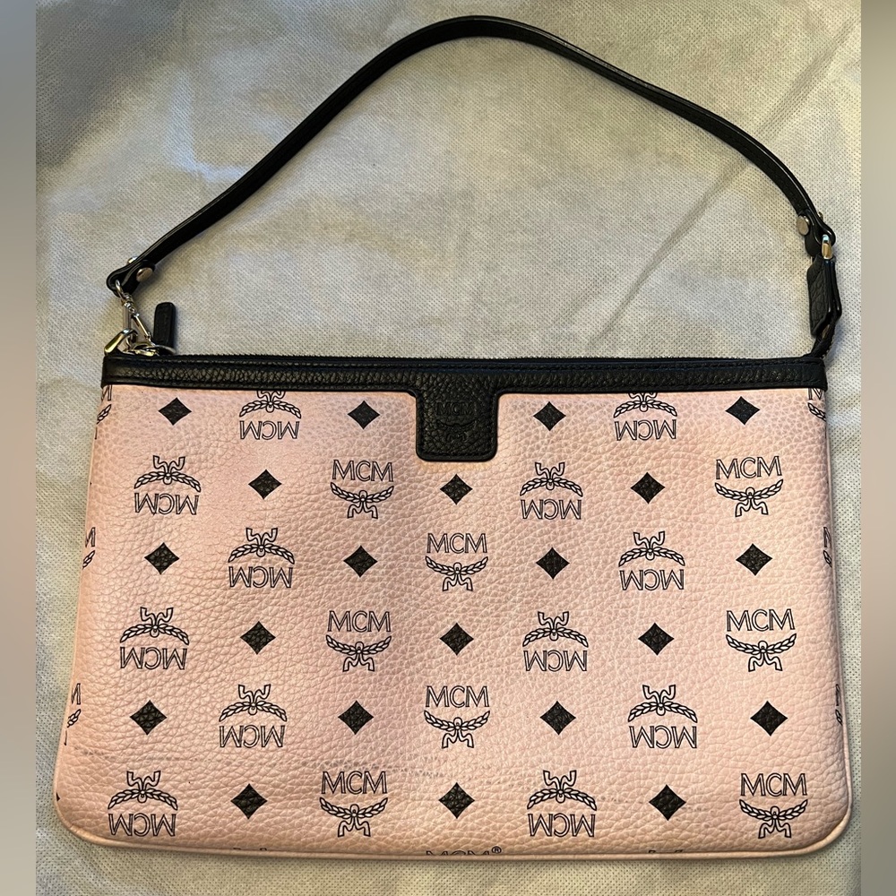 Authentic baby pink MCM wristlet in excellent condition.